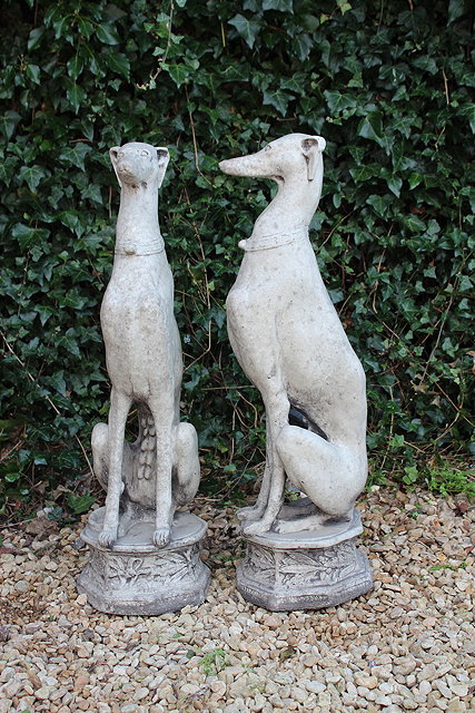 Appraisal: A PAIR OF RECONSTITUTED STONE GATE POST FINIALS in the