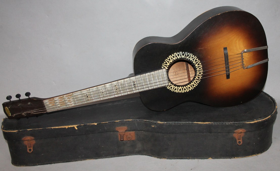 Appraisal: A thC Harmony acoustic guitar with articulated tuning knobs and