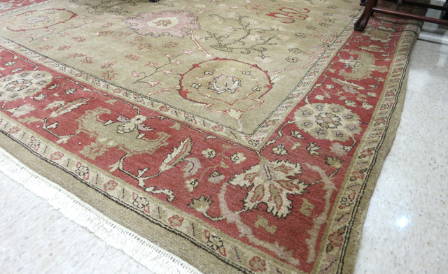 Appraisal: HAND KNOTTED ORIENTAL CARPET Indo-Persian overall floral design on camel