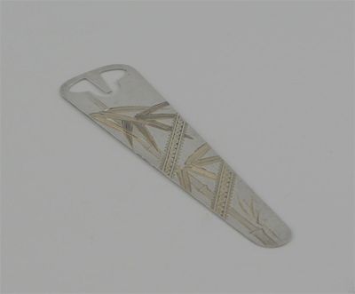 Appraisal: A modern parcel-gilt bookmark engraved in the Japanese style in