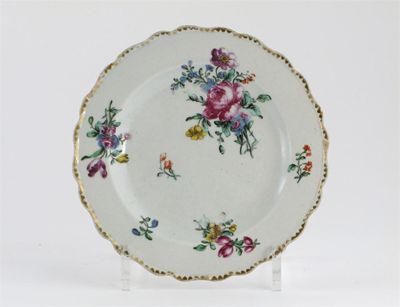 Appraisal: A Bow small plate with scalloped edge painted with flower