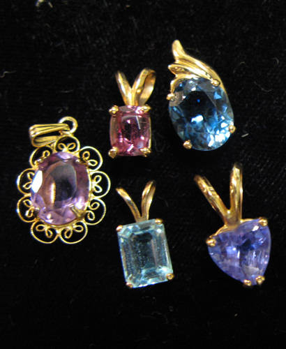 Appraisal: FIVE COLORED GEMSTONE AND YELLOW GOLD PENDANTS each set with