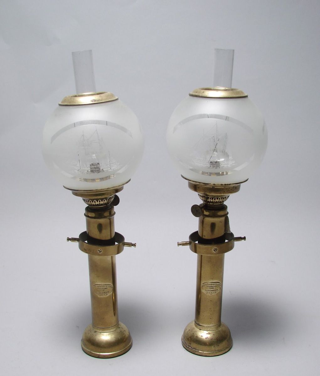 Appraisal: PAIR OF BRASS GIMBALED OIL LAMPS th CenturyWith frosted globes