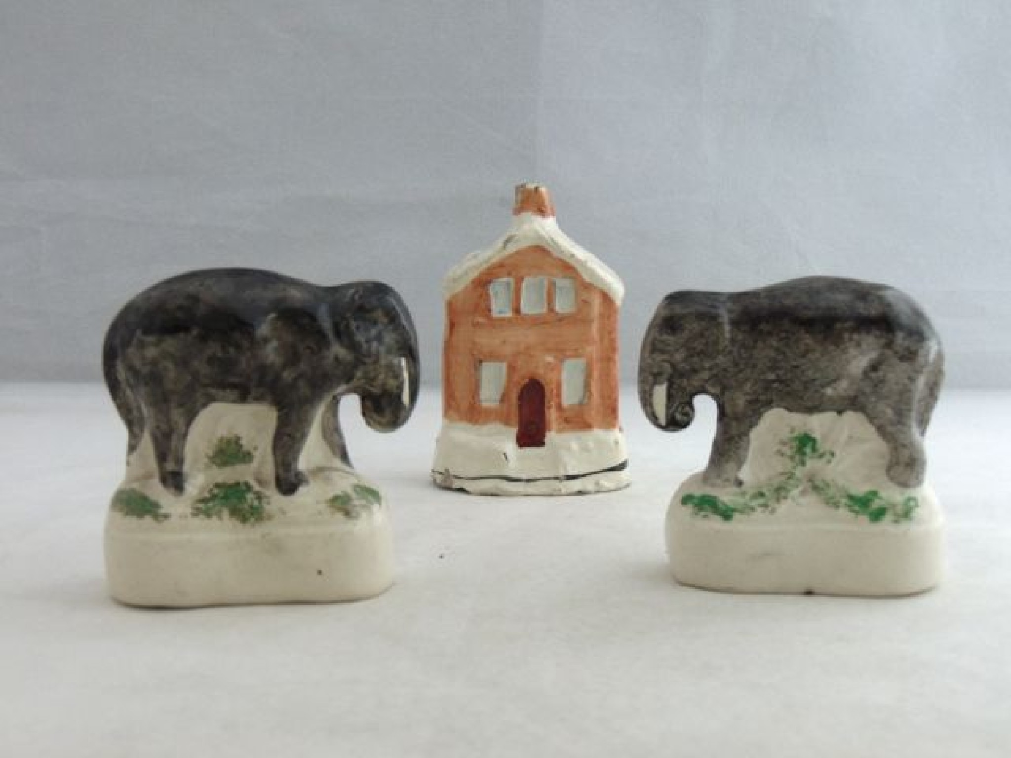 Appraisal: A pair of th century Staffordshire models of elephants with