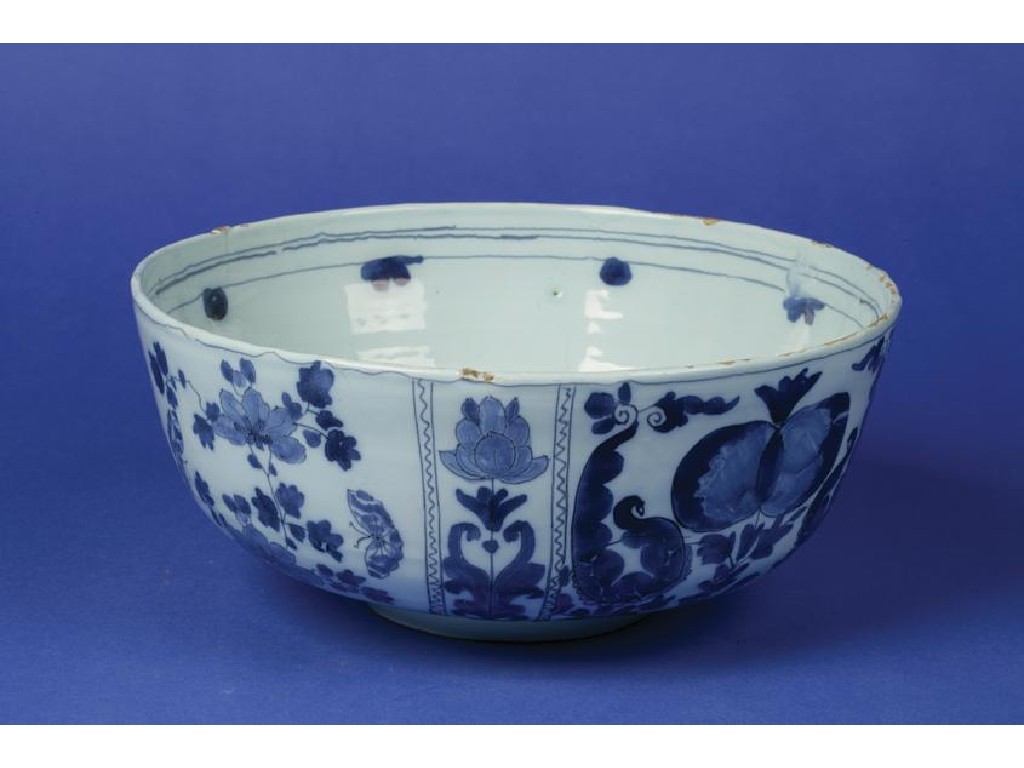 Appraisal: A DELFTWARE BLUE AND WHITE BOWL decorated with panels of