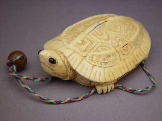 Appraisal: CARVED IVORY SNUFF BOTTLE PENDANT Carved ivory snuff bottle in