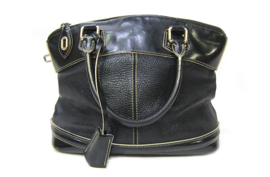 Appraisal: A LOUIS VUITTON HANDBAG IN BLACK SUHALI LEATHER A LOUIS