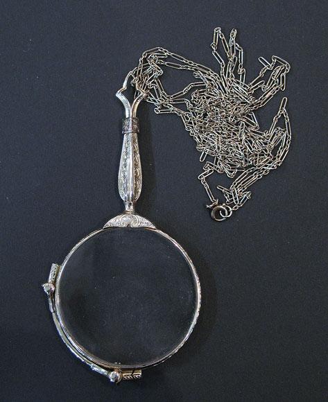 Appraisal: A PAIR OF WHITE GOLD LADIES LORGNETTES with chased decoration