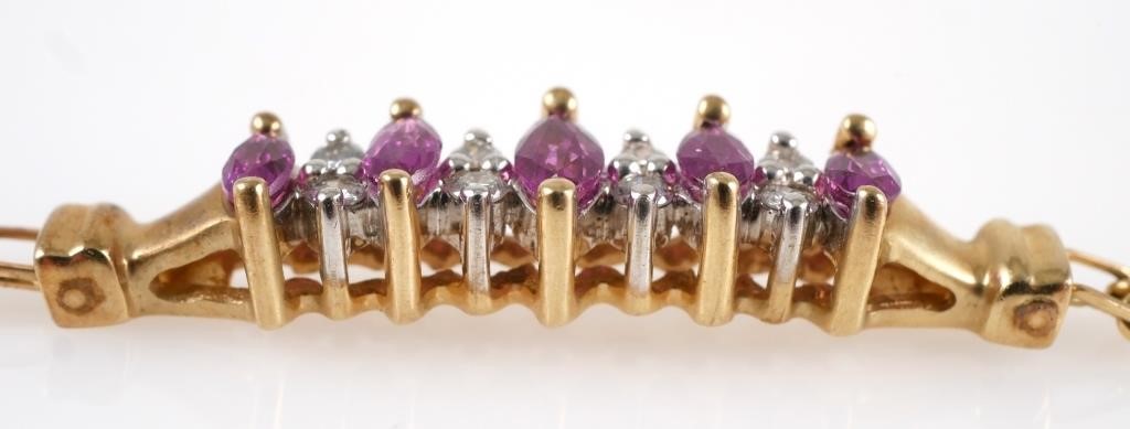 Appraisal: K yellow gold bracelet with marquise cut rubies accented with