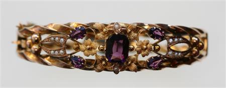 Appraisal: A ct gold Edwardian amethyst and pearl set hinged bangle