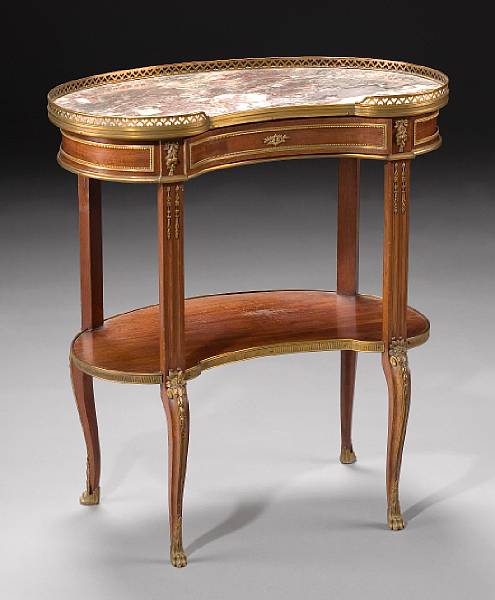 Appraisal: A Louis XVI style gilt bronze mounted mahogany table Sormani