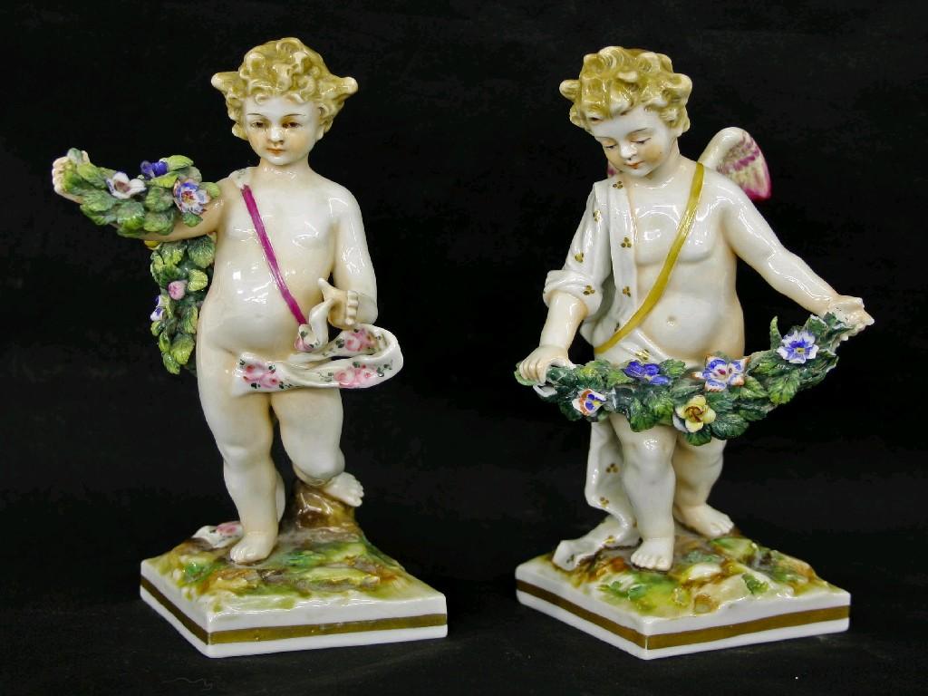 Appraisal: Pair of th century porcelain figures modelled as angels holding