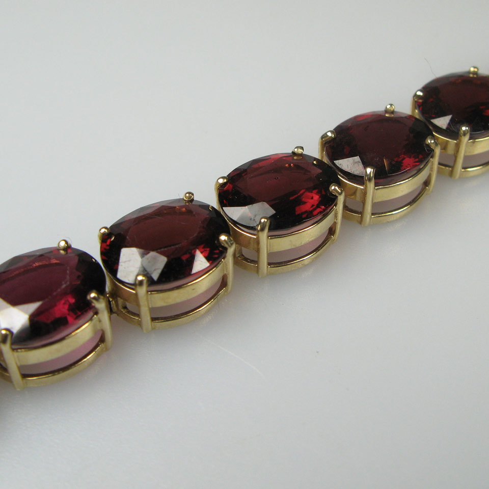 Appraisal: English k Yellow Gold Bracelet set with oval cut rhodolite