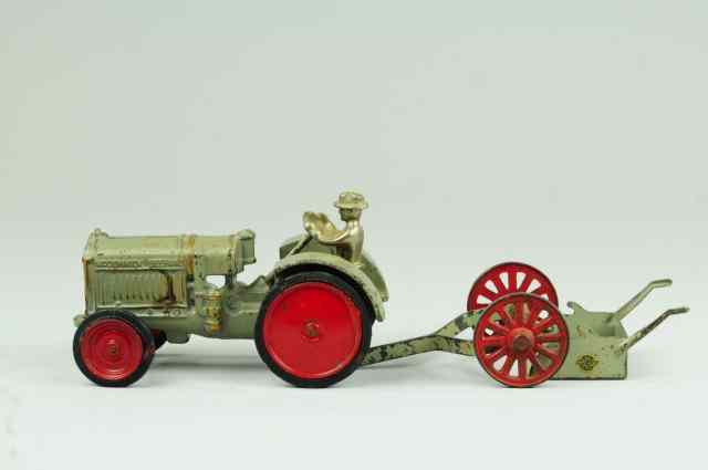 Appraisal: McCORMICK DEERING TRACTOR AND SCRAPER Arcade cast iron painted in