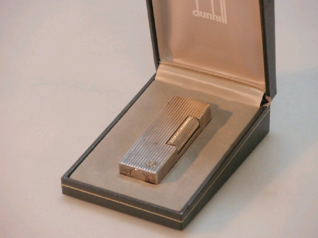 Appraisal: A cased Dunhill petrol lighter