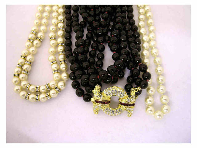 Appraisal: Three Nolan Miller costume necklaces including double strand faux pearl