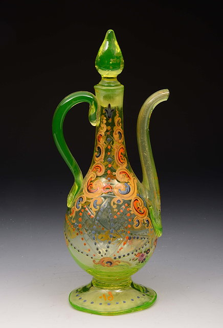 Appraisal: A BOHEMIAN GREEN GLASS ROSE WATER BOTTLE AND STOPPER of