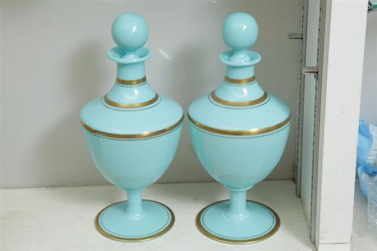 Appraisal: PAIR OF FRENCH BLUE GLASS URNS With gilt decorated banding