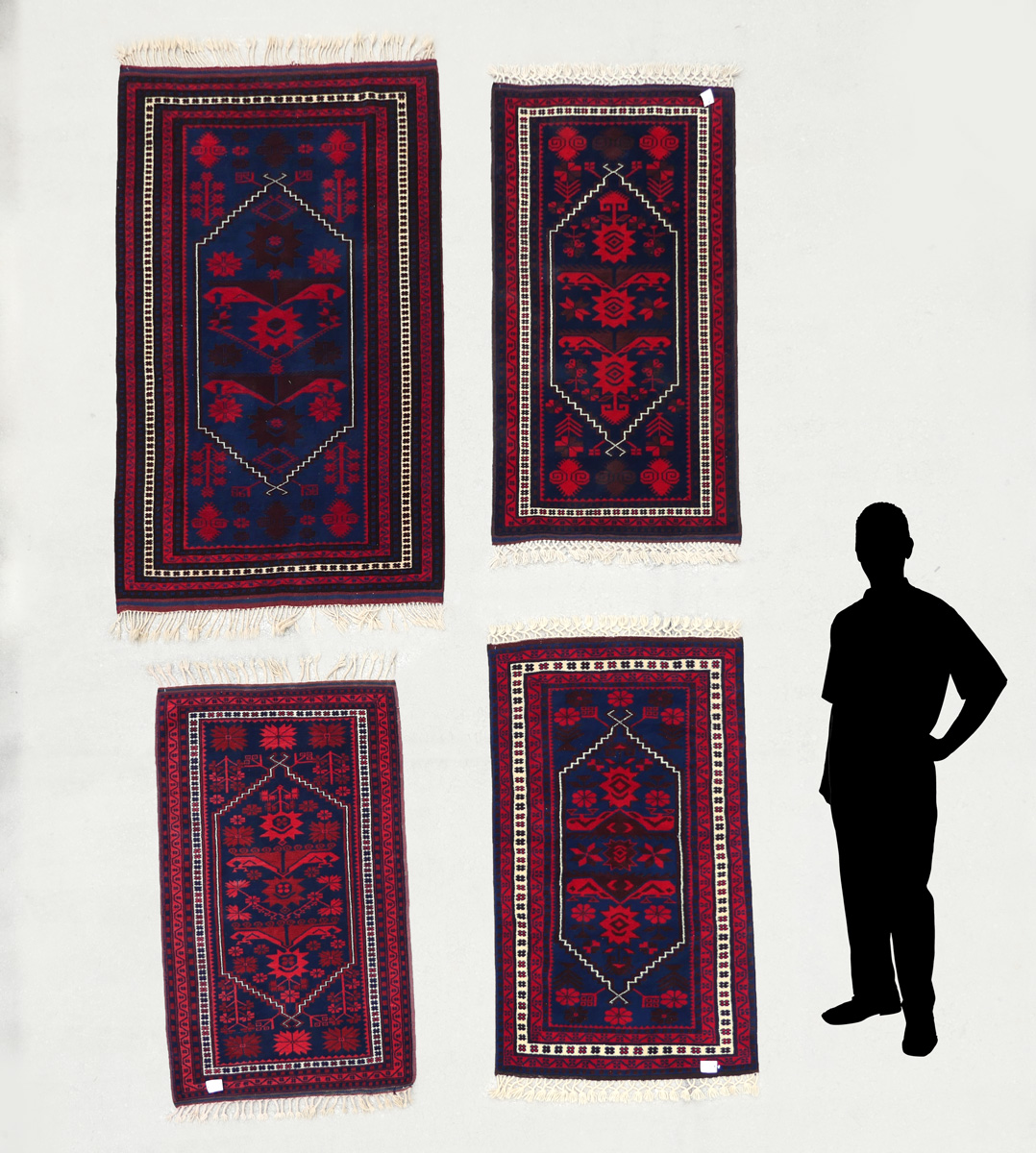 Appraisal: SMALL MATCHING TURKISH YAGCI-BEDIR HAND KNOTTED WOOL RUGS These attractive