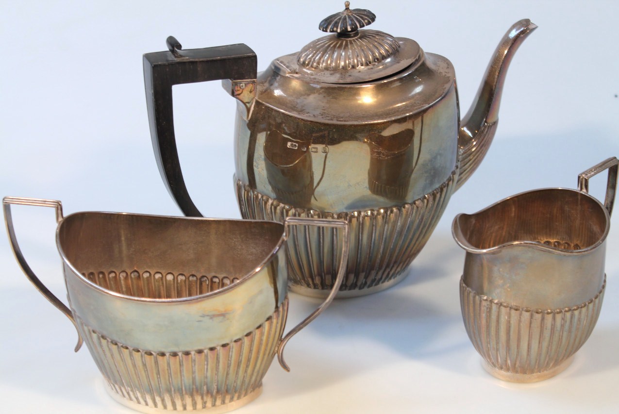 Appraisal: An Edwardian silver three piece tea service by Joseph Gloster