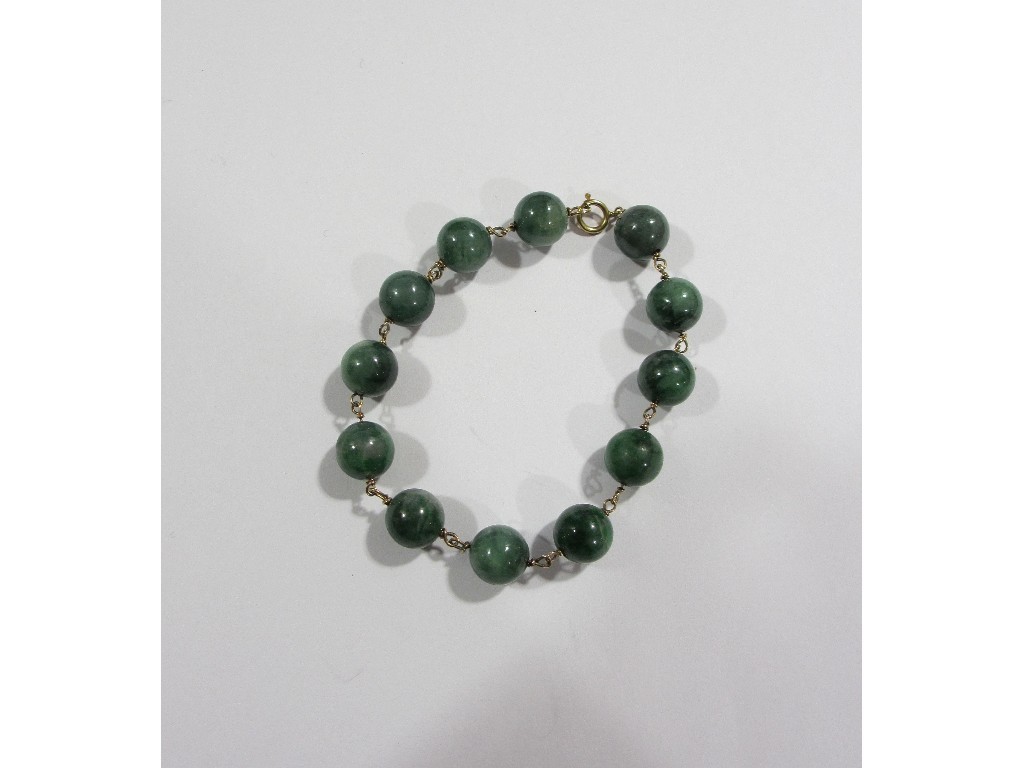 Appraisal: Chinese jade bead bracelet mounted in ct gold