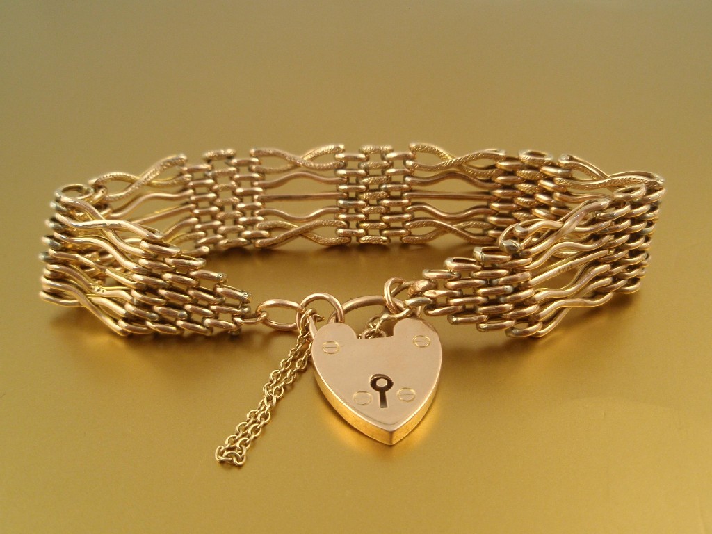 Appraisal: A ct gold fancy link gate bracelet with padlock clasp