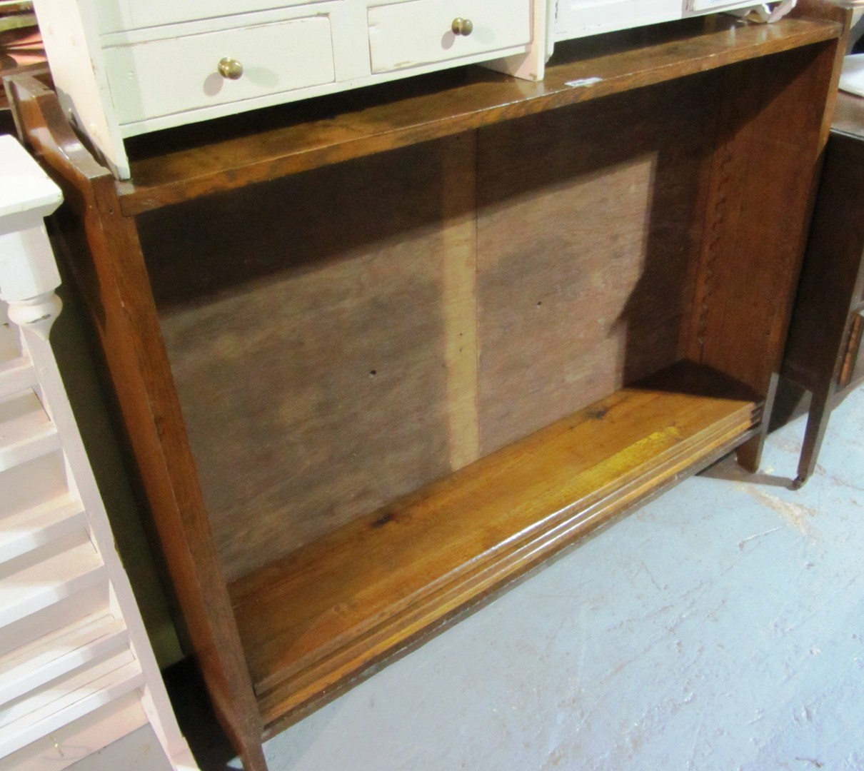 Appraisal: A th century oak freestanding bookcase with blind carved fret