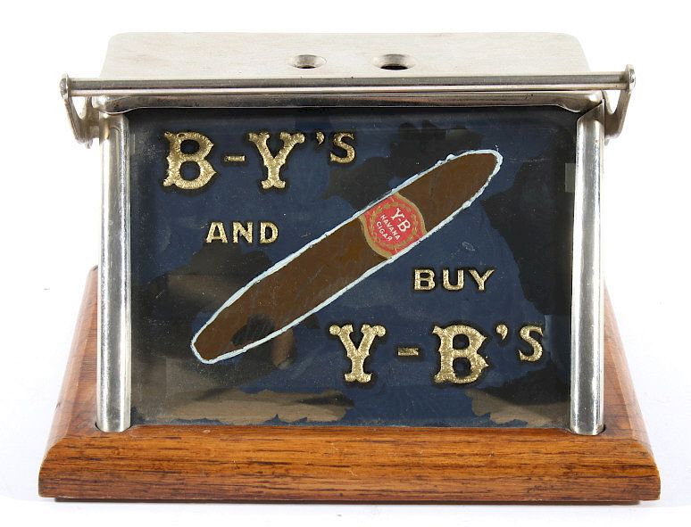 Appraisal: Y-B's Cigar Tip Cutter and Counter Top Advertising Offered in