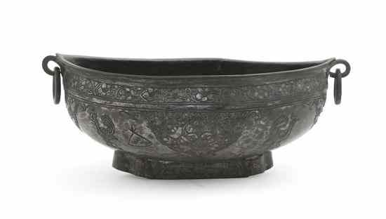 Appraisal: A Middle Eastern Silvered Metal Bowl of elliptical form with