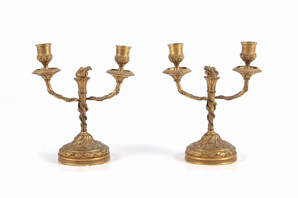 Appraisal: A pair of Louis XVI style gilt bronze twin light