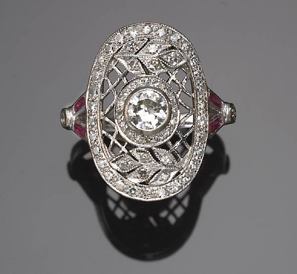 Appraisal: A diamond and red stone ring with intricate filigree design