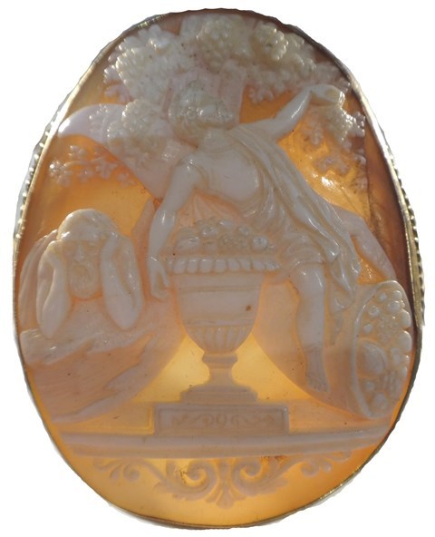 Appraisal: A gold mounted oval shell cameo brooch carved as two