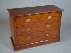 Appraisal: A campaign style mahogany chest of drawers th century the