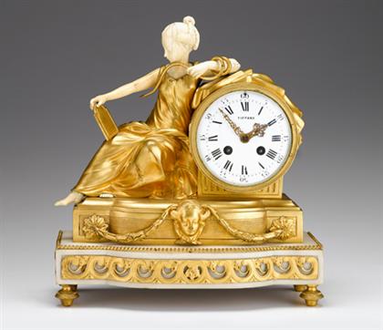 Appraisal: French gilt bronze and ivory mantle clock retailed by tiffany