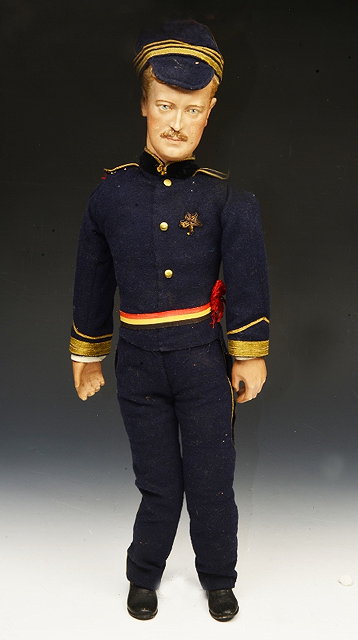 Appraisal: A MILITARY DOLL the officer in formal dress his cap