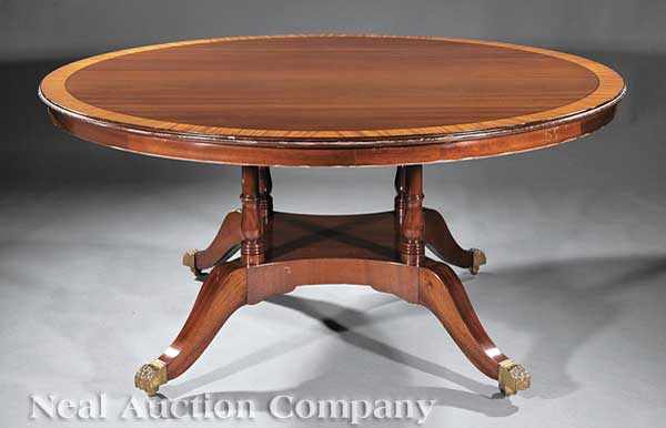 Appraisal: A Regency-Style Carved Mahogany Extension Dining Table circular banded top