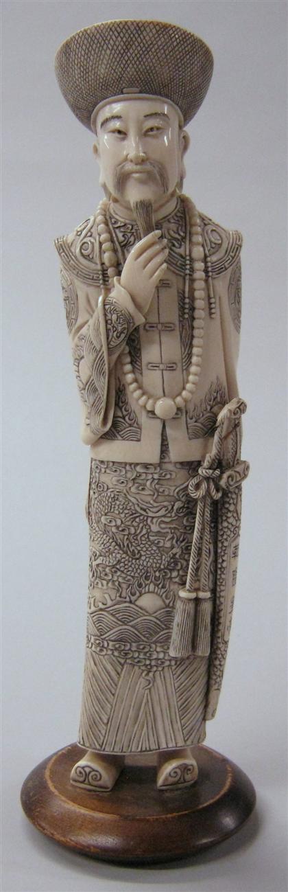 Appraisal: Chinese elephant ivory carving of Qianlong emperorStanding Qianlong emperor dressed