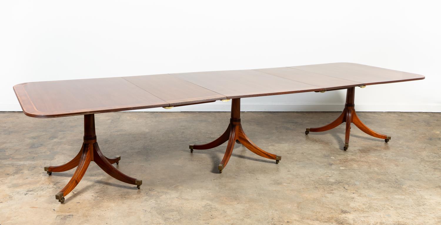 Appraisal: GEORGIAN-STYLE TRIPLE-PEDESTAL DINING TABLE American or English mahogany and mahogany