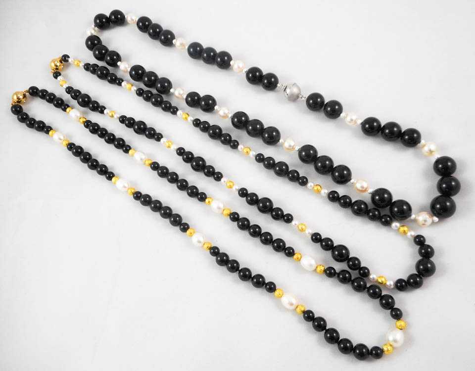 Appraisal: THREE BLACK ONYX BEAD AND PEARL NECKLACES including a -