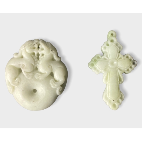 Appraisal: Two Chinese carved jade pendants Crucifix - x cm