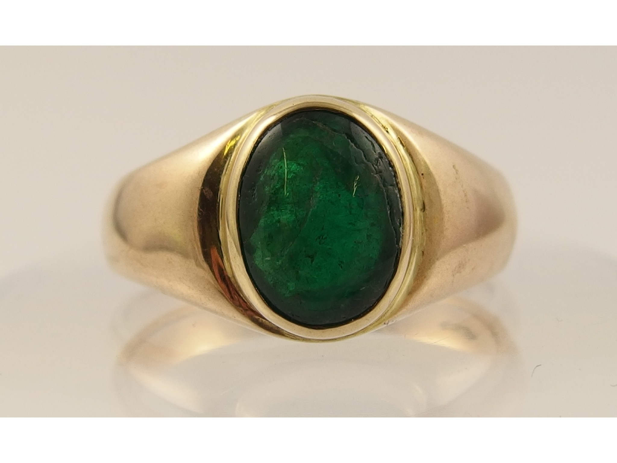 Appraisal: A ct Gentleman's Ringset with a green cabouchon gem stone