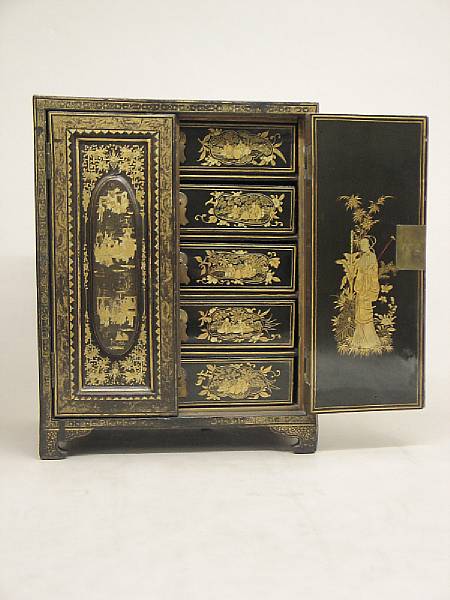 Appraisal: A Chinese export gilt decorated black lacquer table cabinet mid