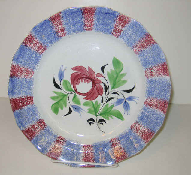 Appraisal: ENGLISH SPATTERWARE Red and blue rainbow spatter plate decorated with