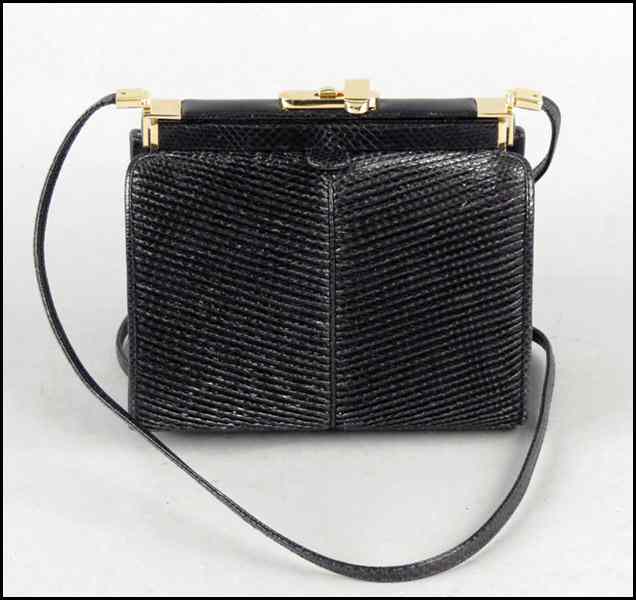 Appraisal: JUDITH LEIBER REPTILE SKIN HANDBAG With hand mirror and comb