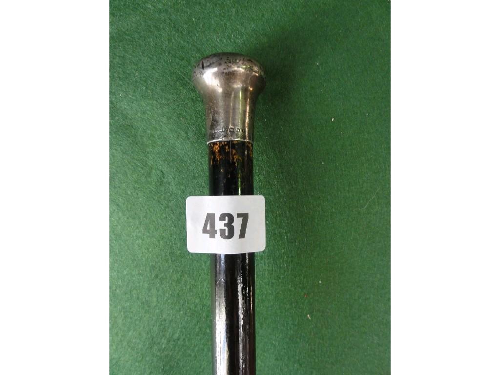 Appraisal: A gentleman's ebonised cane with a silver knop indistinctly marked