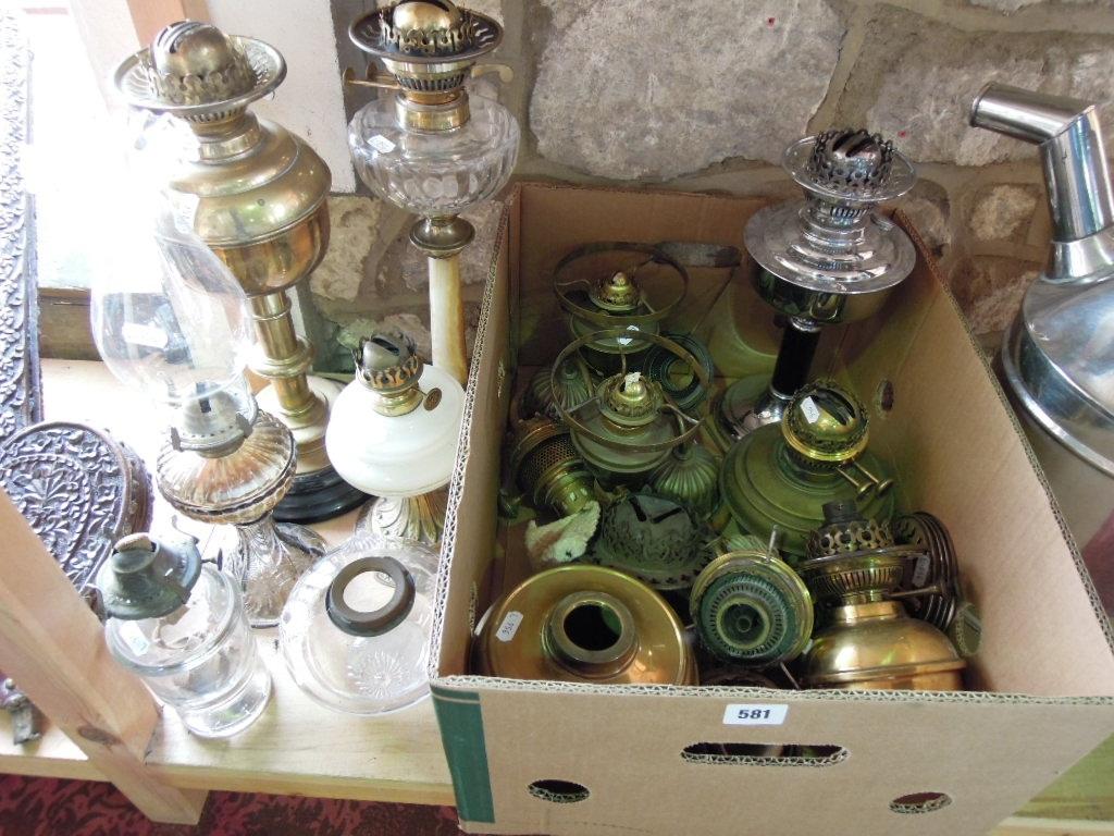 Appraisal: A large assortment of brass oil lamp parts including reservoirs