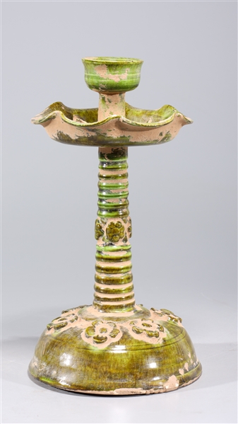 Appraisal: Chinese green glazed ceramic candlestick with molded flowers to body