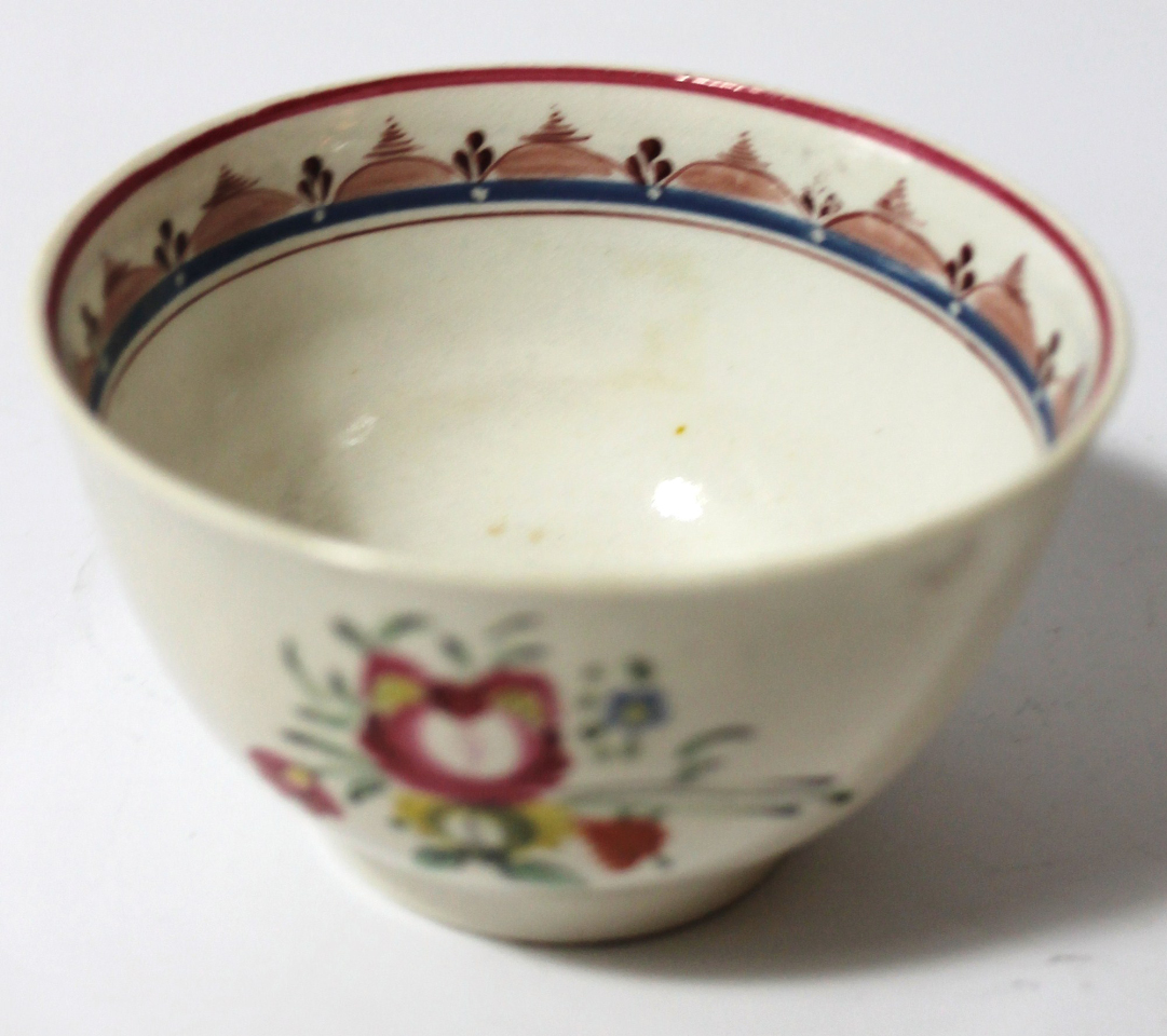 Appraisal: A late thC English porcelain tea bowl polychrome decorated with