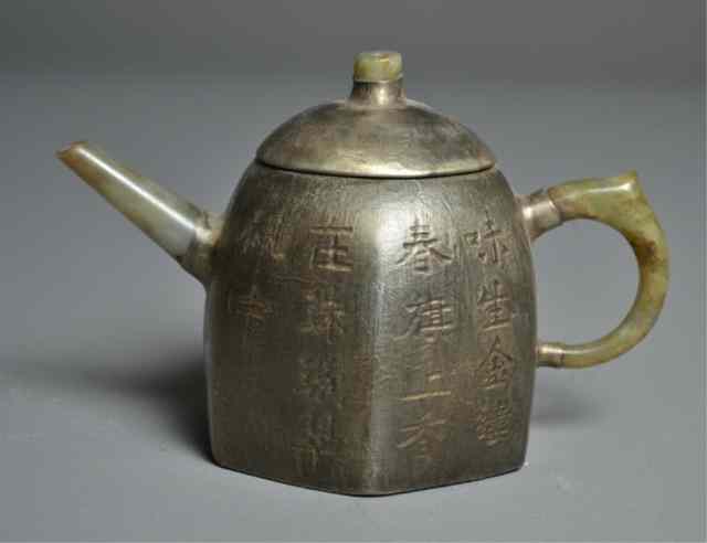 Appraisal: Chinese Yixing Teapot with Jade Spout HandleHexagonal Yixing teapot wrapped