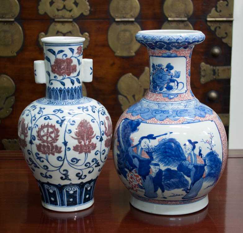 Appraisal: TWO CHINESE PORCELAIN BALUSTER VASES having a blue and iron